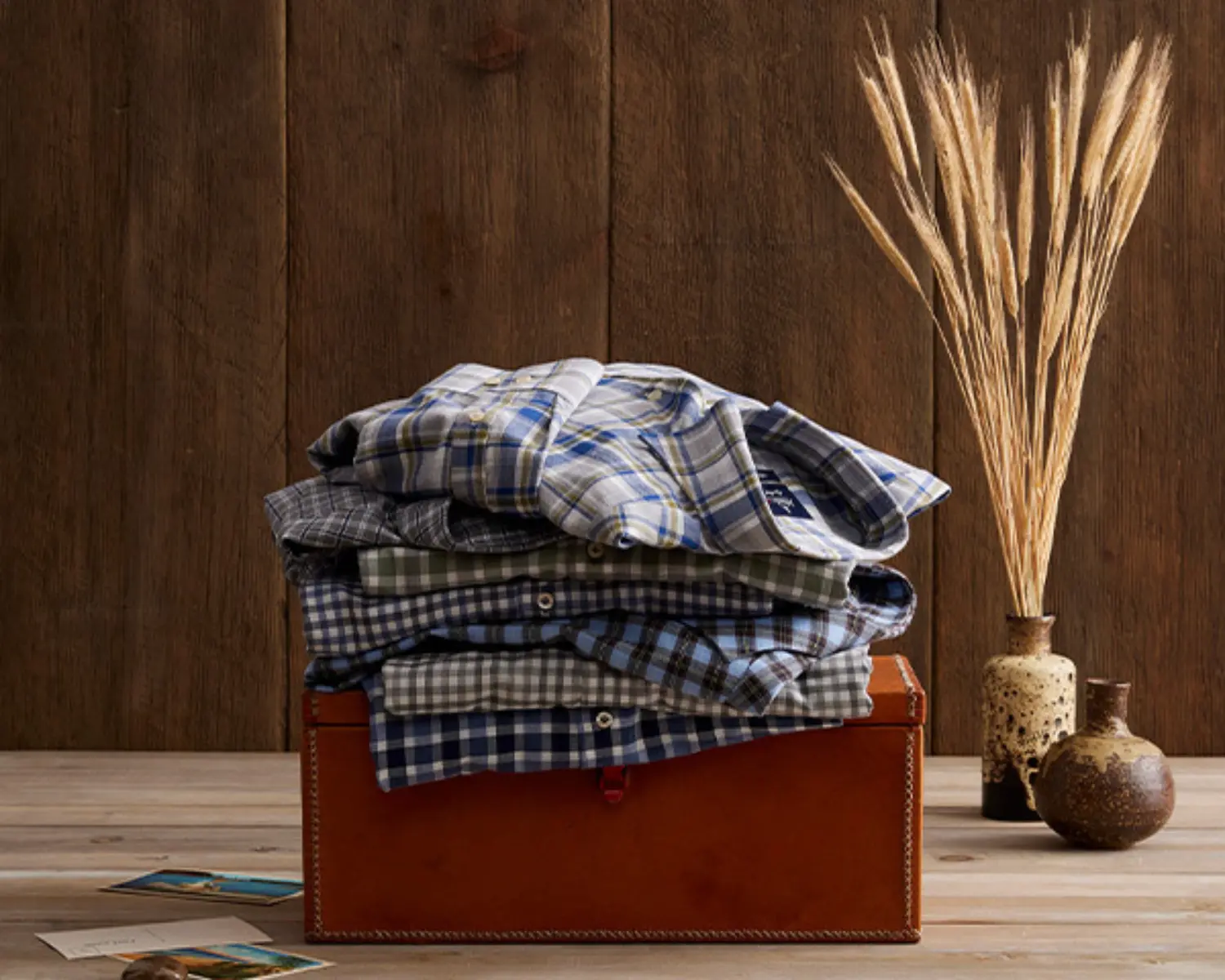 Stack of plaid button down shirts